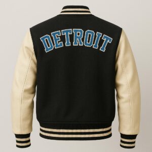 A back view of the Axel Foley jacket showing large “DETROIT” lettering across the shoulders in collegiate-style font.