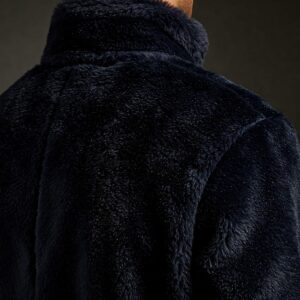 Detailed texture of a soft faux fur jacket designed for men.