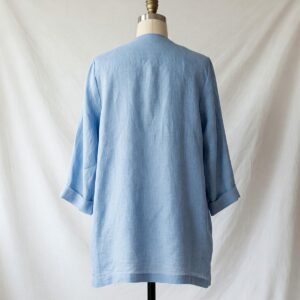  Elegant light blue linen jacket for women, perfect for spring and summer layering.