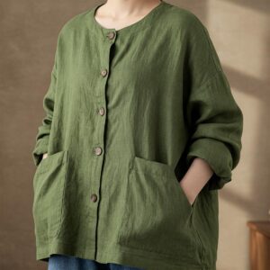 Comfortable oversized green linen jacket with large front pockets, offering both style and practicality.