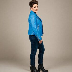 A woman confidently wearing a fashionable blue leather jacket.