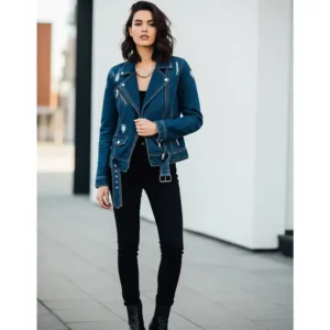 Stylish person confidently wearing a dark wash denim moto jacket, paired with black jeans and leather boots, showcasing a classic and edgy look.