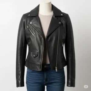 Front view of a sleek black women's leather motorcycle jacket displayed on a mannequin, showcasing its cut and fit.