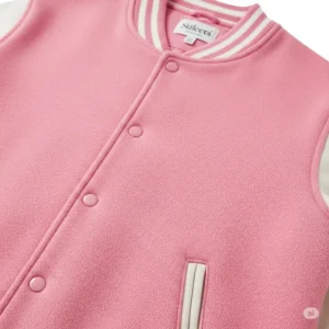  Close-up illustration detailing the soft texture and durable material of a premium pink varsity jacket, perfect for casual wear.
