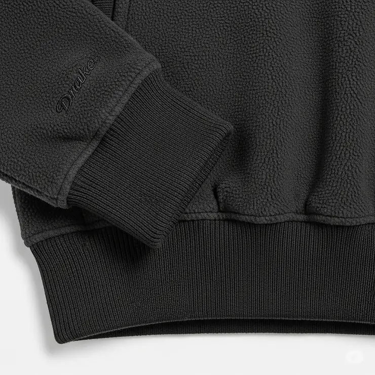 The ribbed cuff and hem of the Drake pullover jacket, which provide a comfortable and secure fit.