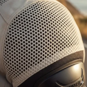 Close-up showing the high-flow mesh panels and textile construction of a summer moto jacket designed for maximum ventilation.