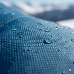 Close-up of the rugged, waterproof, and breathable DWR shell fabric of the womens snowmobile jacket.