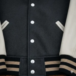 Image illustrating the snap button closure system on a traditional varsity baseball jacket.