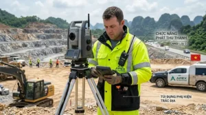 A highway surveyor on a road construction site wearing an ANSI Class 3 hi-vis jacket with radio pockets and mic tabs.