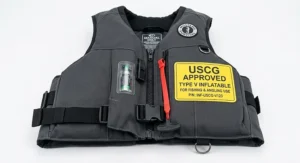 US Coast Guard approved type V inflatable fishing life jacket displayed flat against a white background.