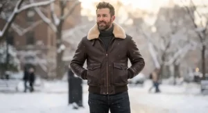 Warm winter leather bomber jacket for men featuring a plush shearling fur collar.